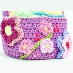 Adorable Crocheted Easter Basket. Crafted in mauve with pretty flowers || thecrochetspace.com