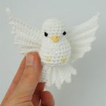 Amigurumi Pigeon In Flight. White pigeon with outstretched wings || thecrochetspace.com