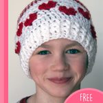 Baby Mine Crocheted Hat With Hearts. White beanie with red hearts || thecrochetspace.com