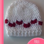 Baby Mine Crocheted Hat With Hearts. White hat with red hearts || thecrochetspace.com