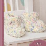 Candy Cotton Crochet Booties. Pair of booties on a white chair || thecrochetspace.com