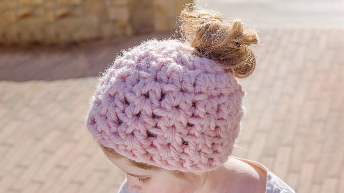 childs crocheted messy bun hat || editor