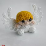 Christmas Crochet Key-Ring Angel. Crafted in sitting position with yellow short hair and fringe || thecrochetspace.com