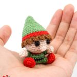 Christmas Crochet Santa Elf. Mini Elf sitting on plam of a hand || thecrochetspace.com