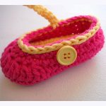 Crochet Baby Booties. Crafted in red and yellow, with yellow button || thecrochetspace.com