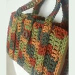 Crochet Book Carrier. Crafted in earth tones || thecrochetspace.com