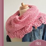 Crochet Bridal Flower Shawl. Crafted in pink and shown worn over a denim jacket || thecrochetspace.com