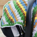 Crochet Car Seat Canopy. Crafted in colorful stripes || thecrochetspace.com