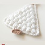 Crochet Christmas Bobble Tree. Decoration laid flat, crafted in white with brown trunk || thecrochetspace.com