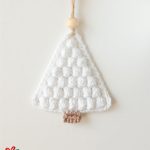 Crochet Christmas Bobble Tree. Hanging decoration crafted in white with brown trunk and cream bead at top || thecrochetspace.com