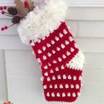 Crochet Christmas Festive Stocking. One stocking crafted in red and white with fur border || thecrochetspace.com