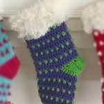 Crochet Christmas Festive Stocking. One stocking crafted in blue and green with fur border || thecrochetspace.com