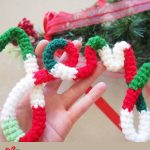 Crochet Christmas Festive Word. The word 'Joy' held aloft || thecrochetspace.com