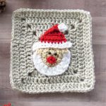 Crochet-Christmas-Santa-Appllique. Beige granny square with snata face applique on it || thecrochetspace.com