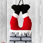 Crochet Christmas Santa Hanging. Greay brickword chimney with red legs and black boots sticking out of the top || thecrochetspace.com
