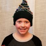 Crochet Christmas Tree Hat. Crafted in Green with golden accents || thecrochetspace.com
