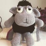 Crochet Ewe-Gene Black Sheep. Crafted in grey with a black wooly coat and large soulful eyes || thecrochetspace.com