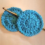 Crochet Facial Scrub Pads. Two, round, face scrubbies crafted in blue.