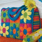 Crochet Flower Power Beach Bag. CRafted in colorful granny squares and crocheted handles || thecrochetspace.com