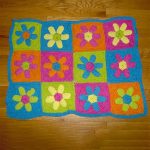 Crochet Flower Power Rug. Crafted in primary colors || thecrochetspace.com