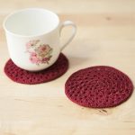 Crochet Granny Circle Coasters. Two, red coasters. One with a tea cup on || thecrochetspace.com
