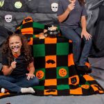 Crochet Halloween Patchwork Throw. Different color squares with halloween motifs || thecrochetspace.com