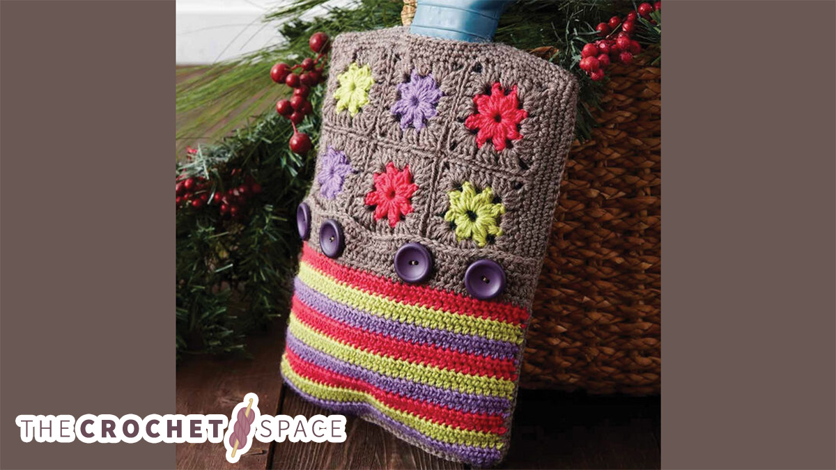 Crochet Hot Water Bottle Cozy. Top half is crafted in grannysquares and the lower part is crafted in stripes || thecrochetspace.com