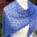 Crochet Mediterranean Lace Shawl. Crafted in beautiful blue with scalopped edging || thecrochetspace.com