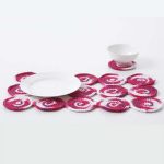 Crochet Spiral Placemat And Coaster Set. Placemat crafted out of circular motif's in raspberry ripple color yarn plus matching circular coaster || thecrochetspace.com