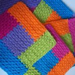Crochet Square Log Cabin Dishcloths. Up close image of four dishcloths crafted in bright multi colors || thecrochetspace.com