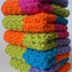 Crochet Square Log Cabin Dishcloths. Crafted in blocks of primary colors.Stack of 5 dishcloths || thecrochetspace.com