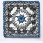 Crochet Triple Puff Granny Square. One close up image of blue/grey square || thecrochetspace.com