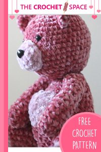 Crochet Velvet Valentine Bear. Bear sitting to the side pale pink muzzle and pale pink heart || thecrochetspace.com