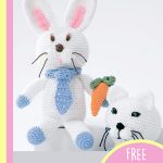 Crocheted Baby Bunny Soft Toy. Rabbit with carrot in his hand. Crafted in white || thecrochetspace.com
