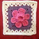 Crocheted Daffodowndillies Square. Crafted in Cream and purple with a pink daffodil in the middle || thecrochetspace.com