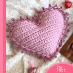 Crocheted Heart Shaped Pillow. Heart shaped pillow with pink edging || thecrochetspace.com