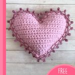 Crocheted Heart Shaped Pillow. Front image of completed pillow || thecrochetspace.com