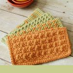 Crunch Stitch Crocheted Dishcloth. 4x folded dishcloths in green and tangerine || thecrochetspace.com