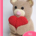 Cuddly Crocheted Amigurumi Teddy Bear. Bear clutching a heart || thecrochetspace.com