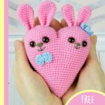 Cute Crocheted Bunny Hearts. Heart held in hands. Blue bow at neck for male and blue bow on top of head for female || thecrochetspace.com