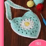 Daisy Heart Crochet Bag. Crafted in turquoise with a granny daisy in the middle of the heart || thecrochetspace.com