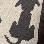 Dapper Dogs Crochet Afghan. Cream and grey afghan crafted with dog in different poses || thecrochetspace.com