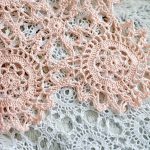 Delicate Dinky Crochet Doilies. joined doiliy motifs in pink laying on top of joined grey doily motifs || thecrochetspace.com