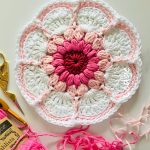 Delightful Crochet Daisy Dishcloth. Daisy Shape. Brightly Colored in Center || thecrochetspace.com