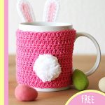 Easter Bunny Crocheted Mug Cozy. Bright pink mug cozy with rabbit ears and a pompom tail || | thecrochetspace.com