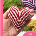 Easy Brioche Crochet Heart. Holding one red/cream heart || thecrochetspace.com