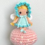 Fairie Pixie Crochet Doll, sitting on a peach mushroom. || thecrochetspace.com