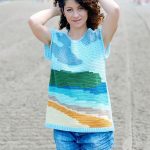 Happy Place Crochet Tee. Front view of Tee with ulti colored beach scene crafted using Intarsia crochet. Sleeveless || thecrochetspace.com