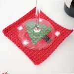 Holiday Tree Crochet Coaster. Glass resting on top of coaster || thecrochetspace.com