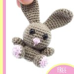 Irresistibly Cute Crocheted Bunny. Mini Rabbit being held by it's ear || thecrochetspace.com